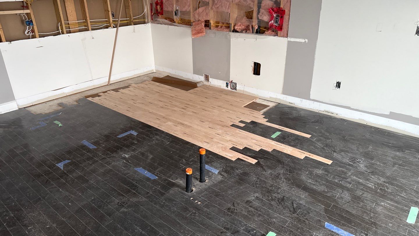 New hardwood stitched into the existing floor before sanding