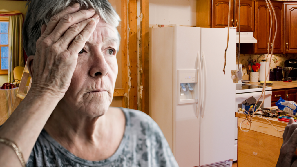 Worried homeowner standing in a half-finished kitchen renovation gone wrong