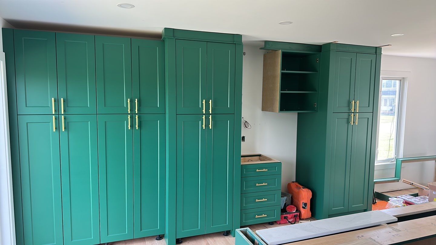 Upper cabinets and crown being fitted