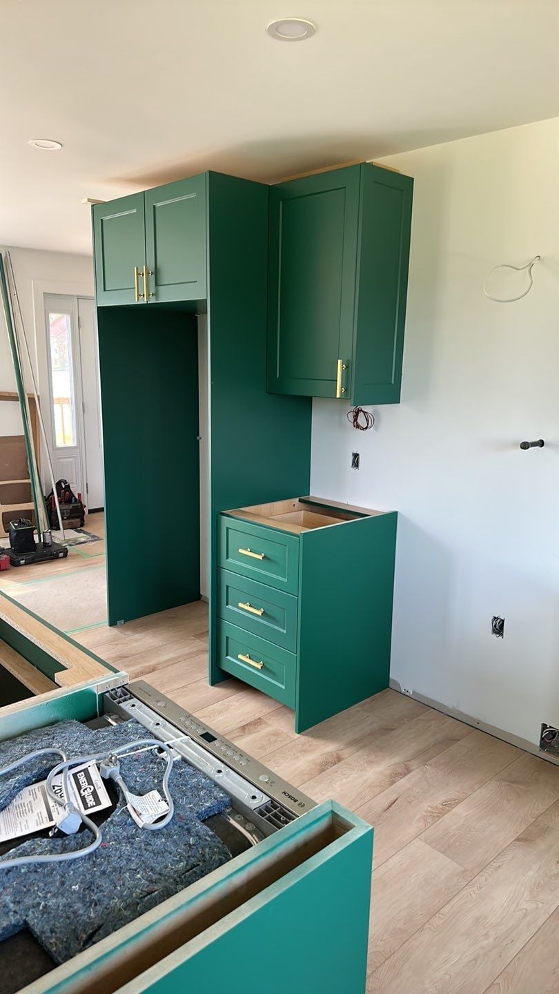 Under-cabinet lighting being installed