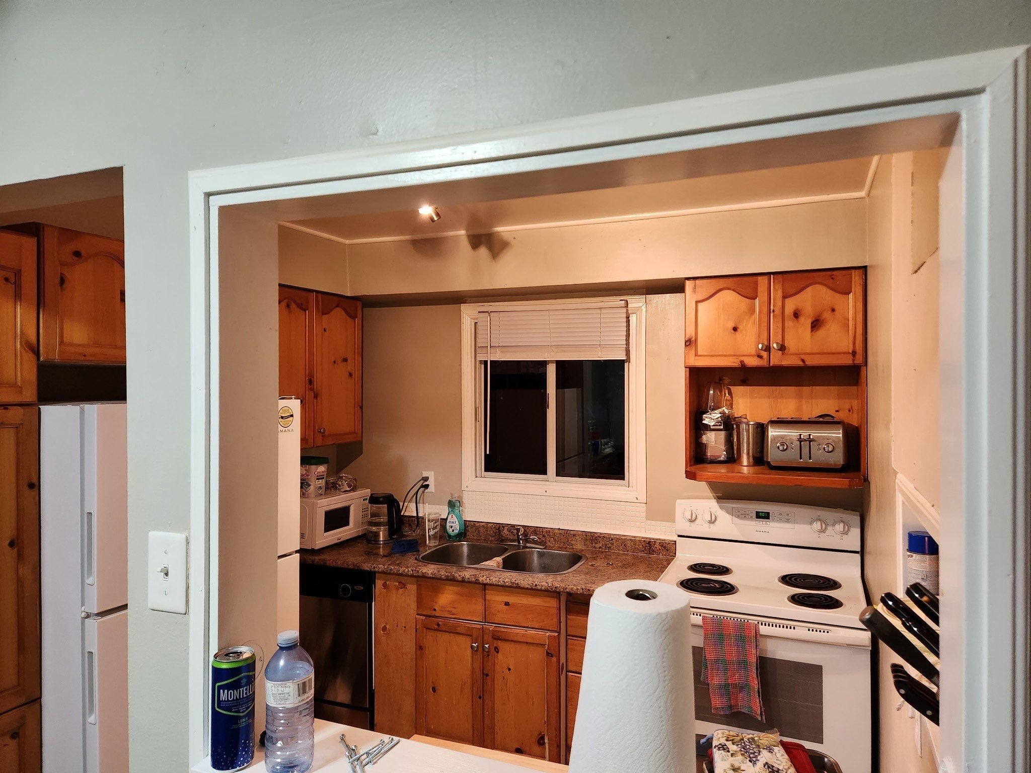 Before — dated Oshawa condo kitchen