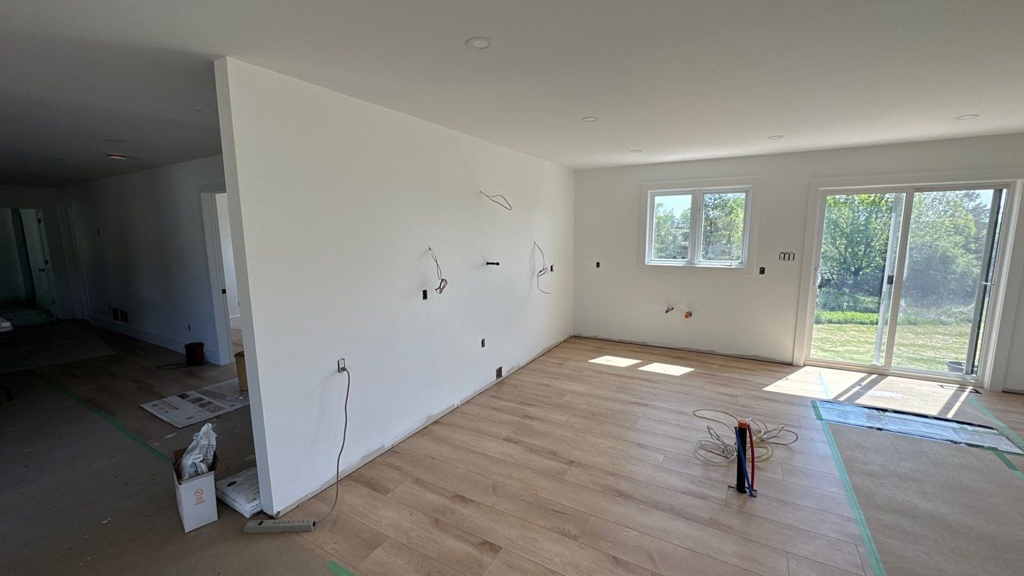 Clean-slate room before the custom kitchen build