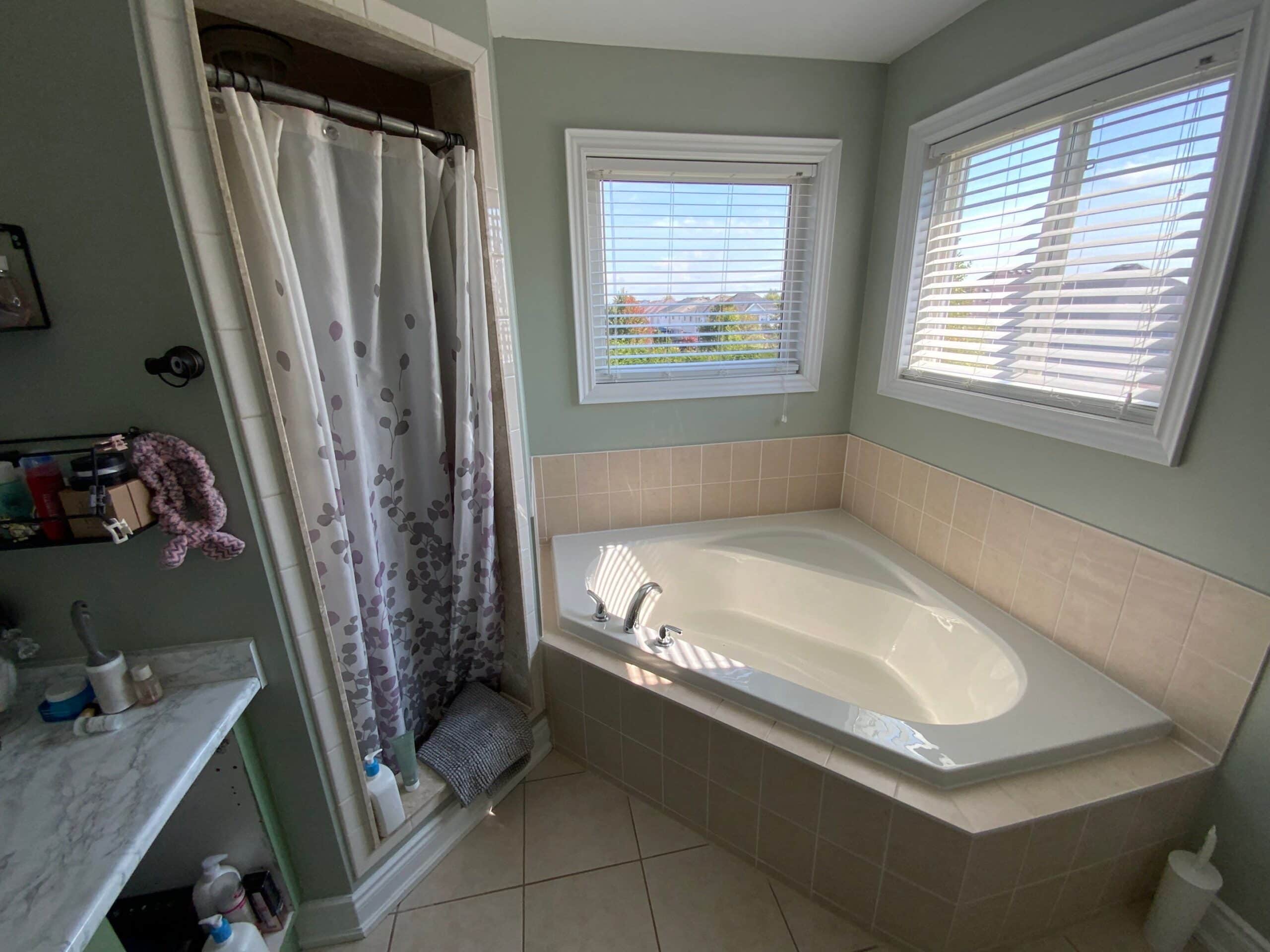 Old bathtub before a tub-to-shower conversion in Bowmanville