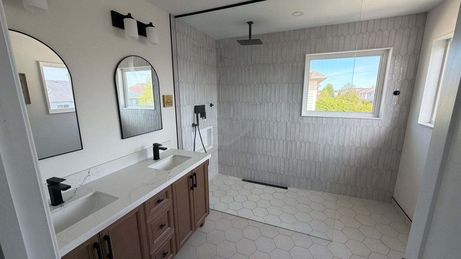 Curbless walk-in shower in an accessible bathroom renovation by Cornerstone Construction in Durham Region