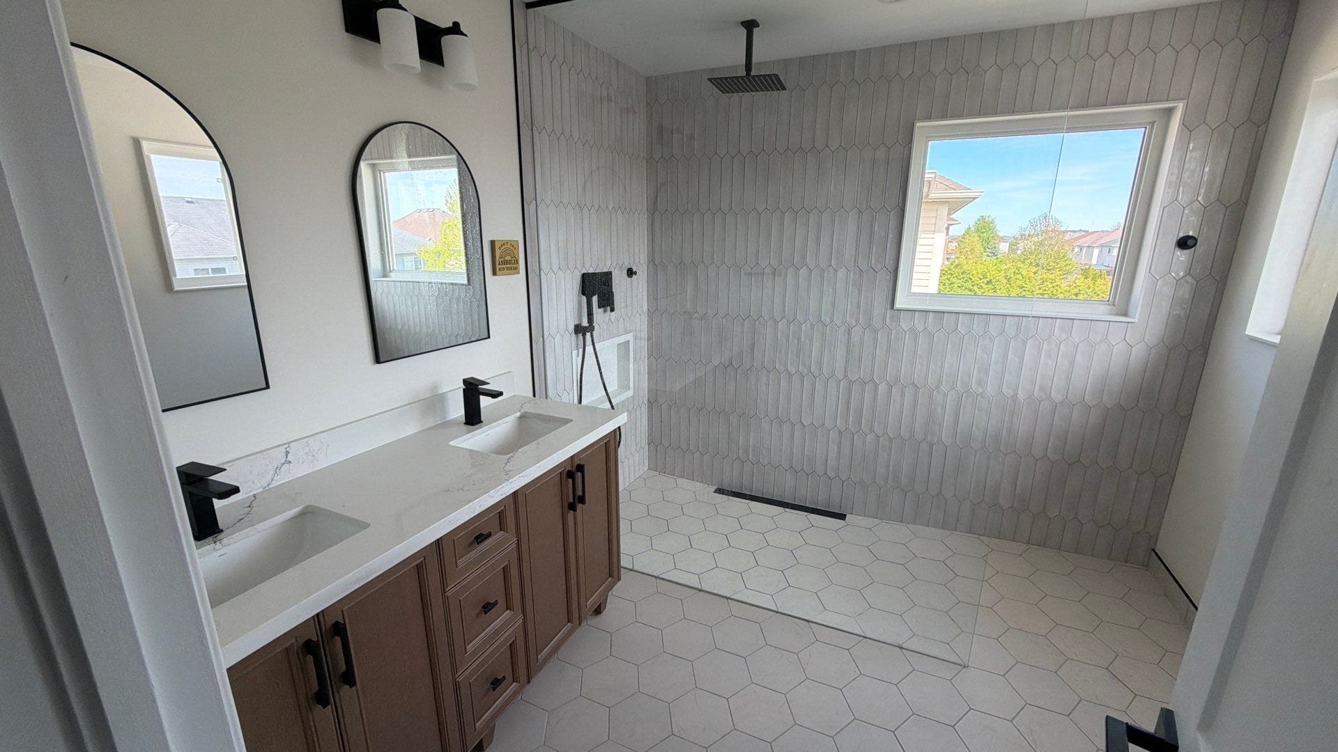 Walk-in shower from a tub-to-shower conversion by Cornerstone Construction in Durham Region