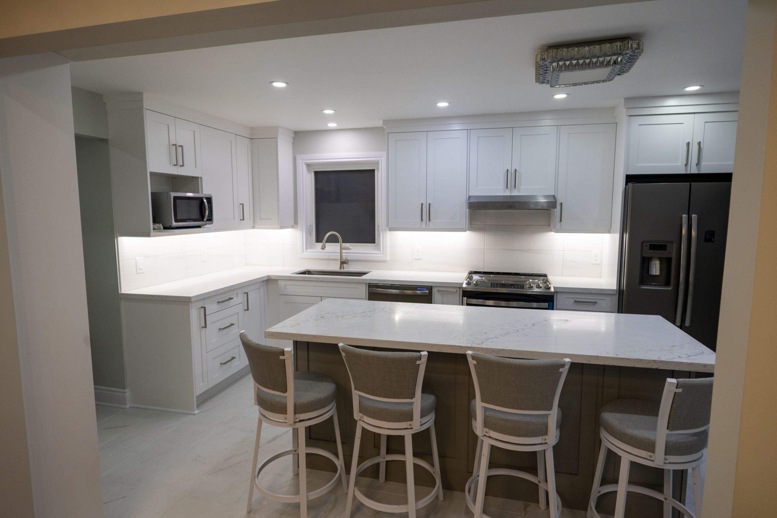 Pickering kitchen with tile backsplash and under-cabinet lighting
