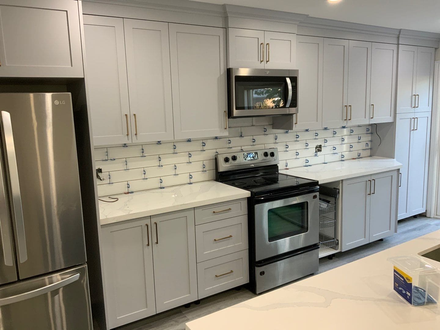 Subway tile backsplash being installed