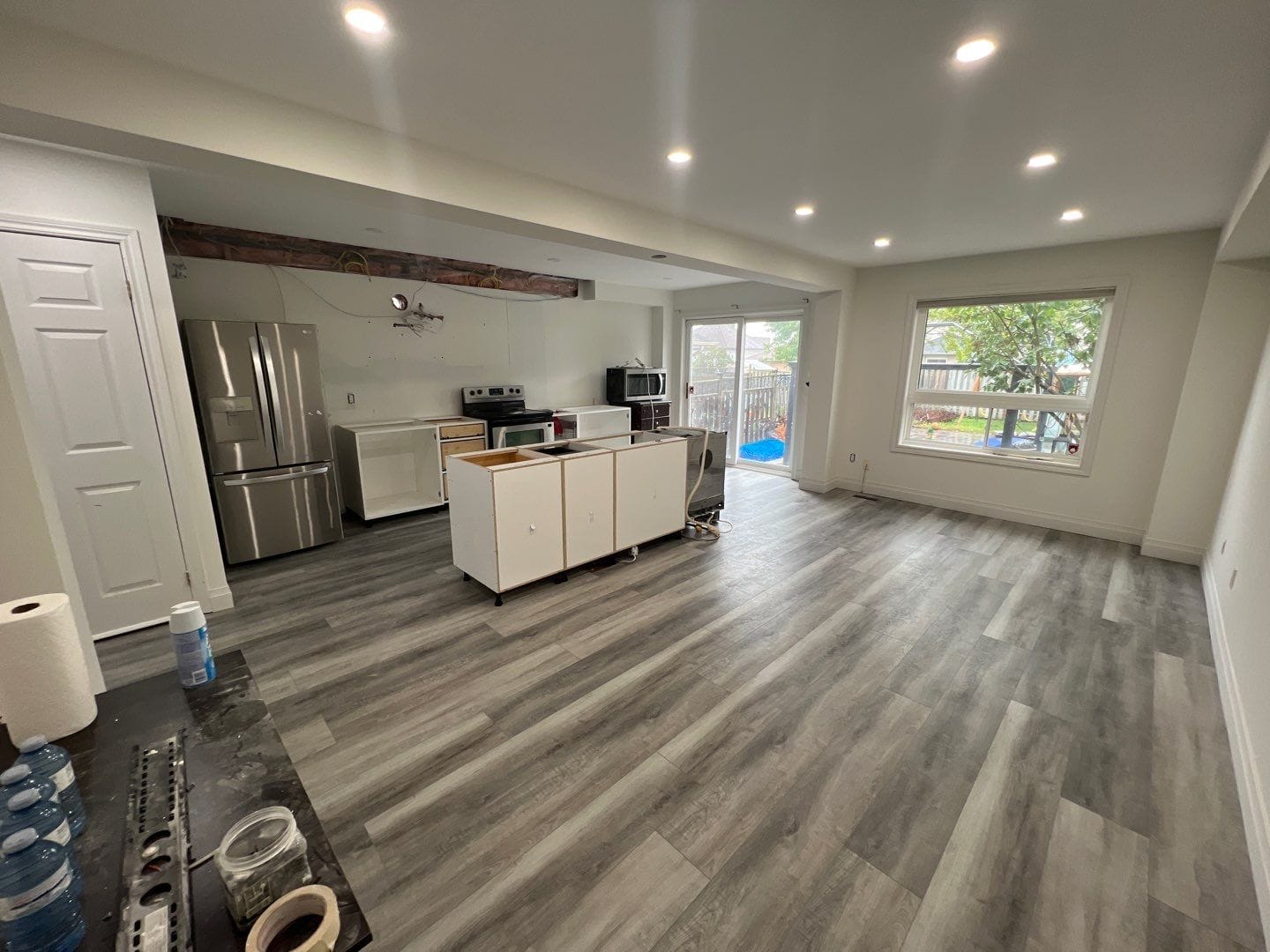Luxury vinyl plank flooring going in across the main floor