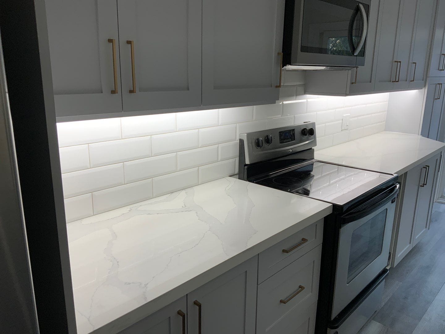 Completed Clarington main floor renovation with quartz counters and subway tile